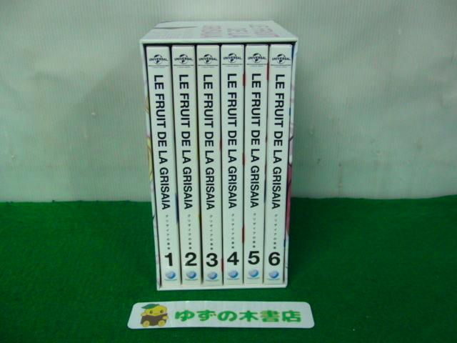 Six-disc Blu-ray boxed set spines labeled "Le Fruit de la Grisaia" numbered 1–6 displayed in a white storage box.