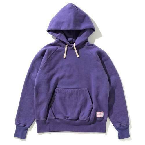 A purple heavyweight raglan sweat parka hoodie laid flat on a white background.