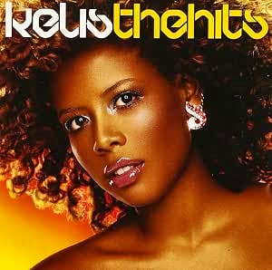 CD cover art showing a close-up portrait of a woman with curly hair and the text "the hits" at the top.