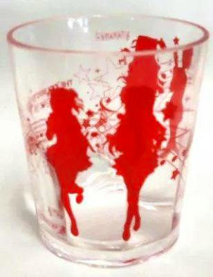 Clear drinking cup with red printed character silhouettes around the glass.
