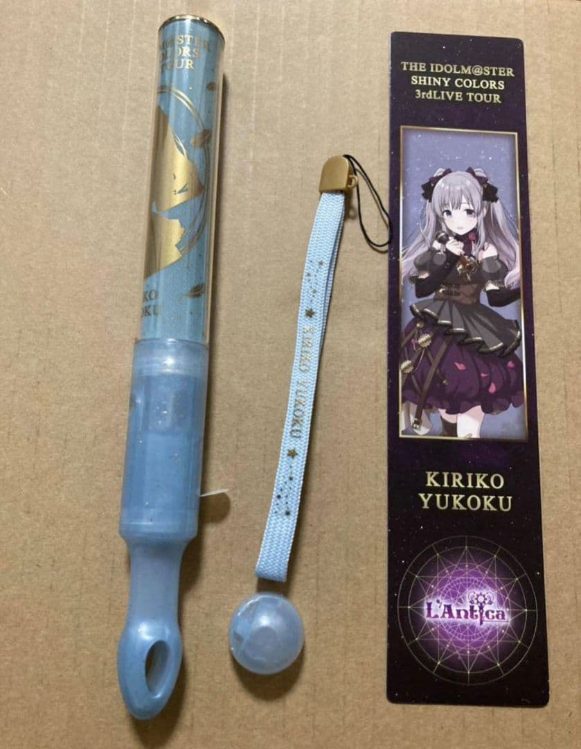 Light blue pen light with matching wrist strap and a Kiriko Yukoku character insert card.
