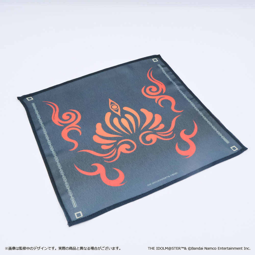 Flat Still blue chiffon handkerchief laid out, showing a central orange stylized emblem and thin decorative borders.