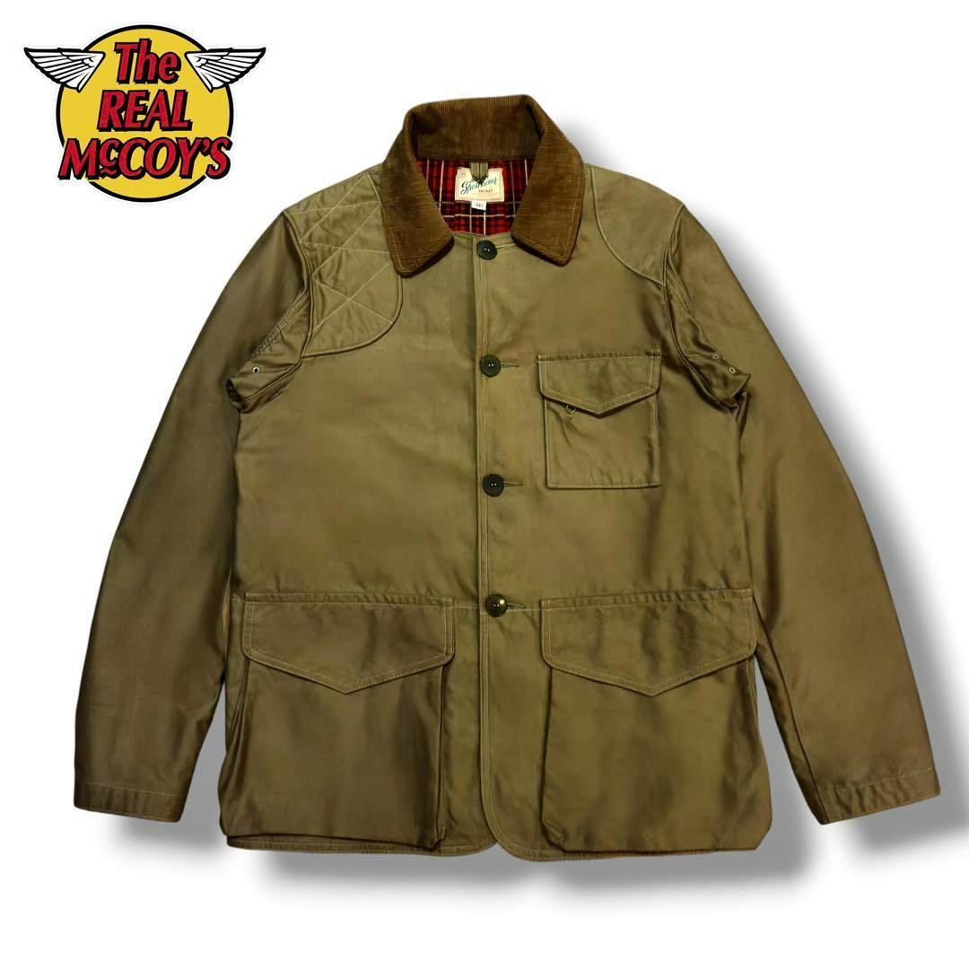 Front view of THE REAL McCOY'S hunting jacket with a corduroy collar, flap pockets, and button closure on a white background.
