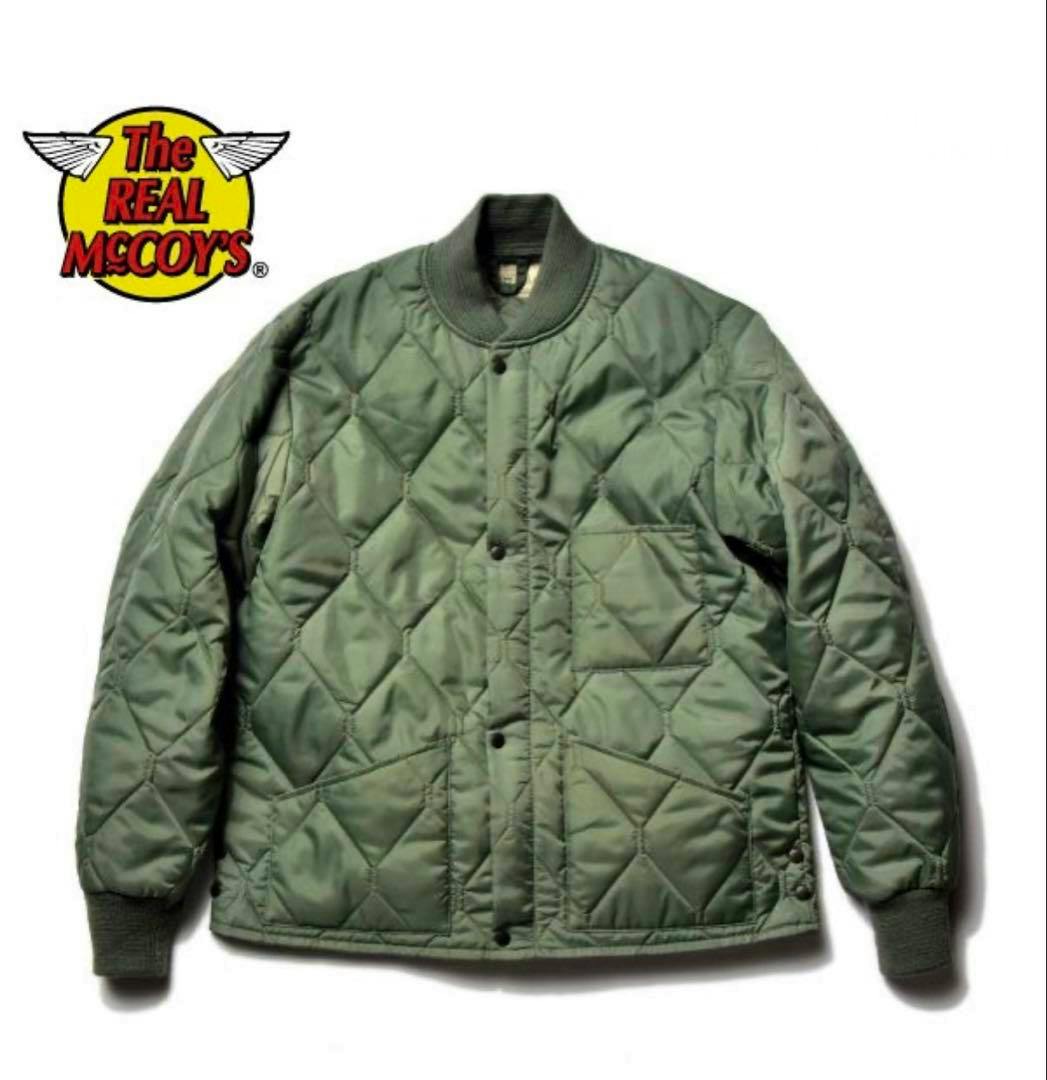 Front view of a green quilted men's CWU 9/P jacket by THE REAL McCOY'S on a white background.