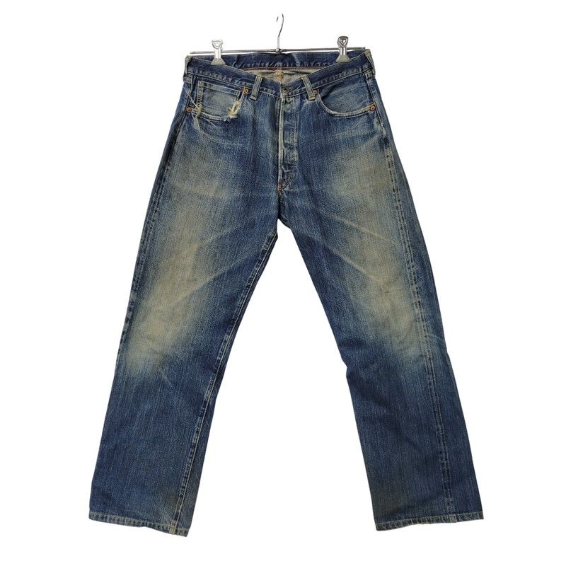 Front view of the men's denim pants hanging on a hanger against a white background.