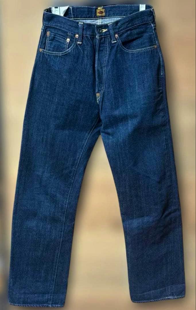 Front view of REAL MCCOYS selvedge denim men's jeans (S611, size 30, dark indigo) laid flat.