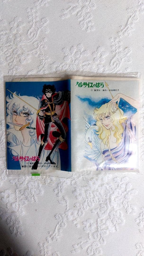 Packaged pocket tissue showing two 'Versailles no Bara' character designs on a white textured background.