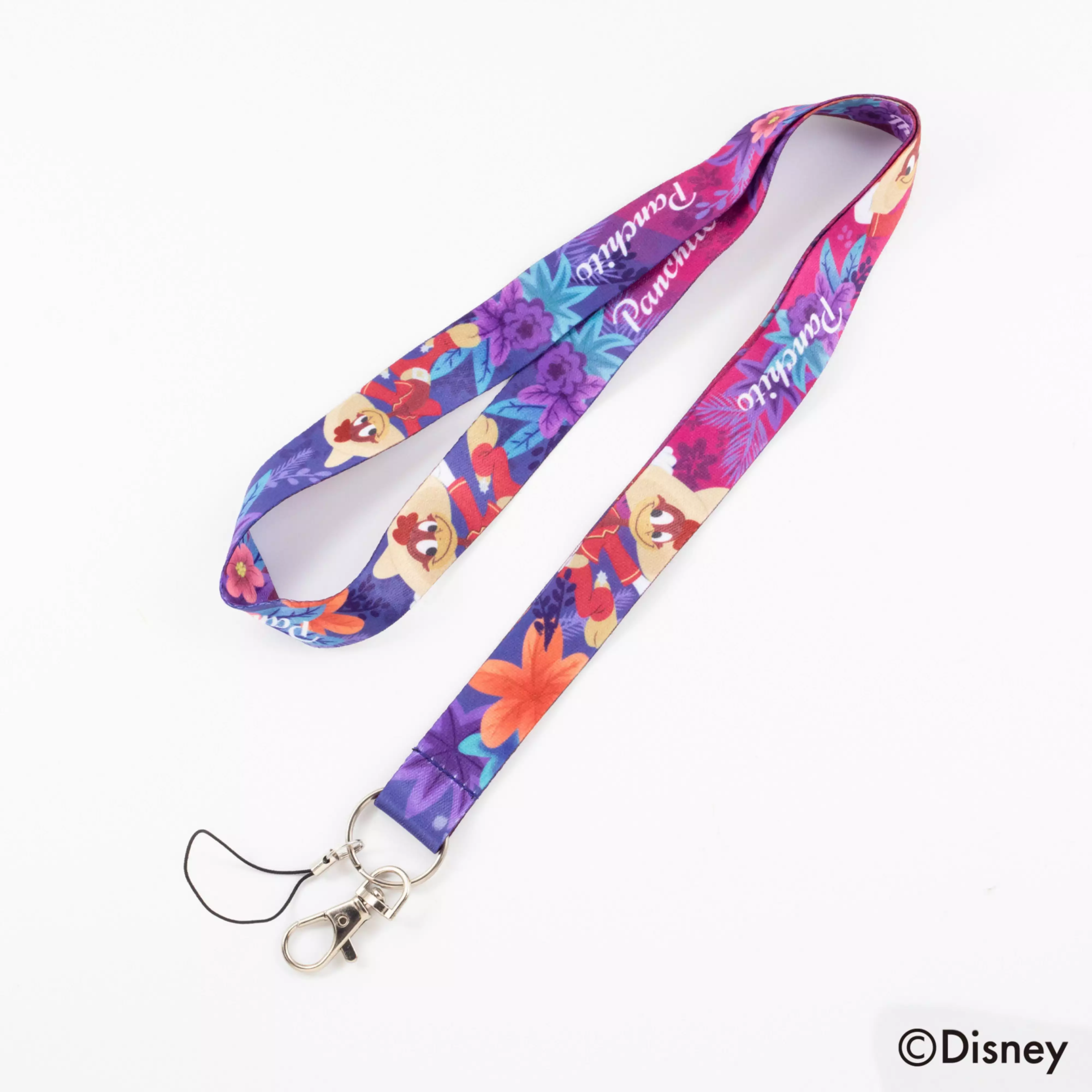 Colorful "Three Caballeros" neck strap featuring Panchito and floral prints, with a metal swivel clasp and small cord attachment.
