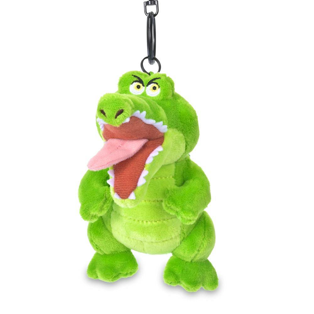 A green crocodile plush keychain with an open mouth and metal ring against a white background.