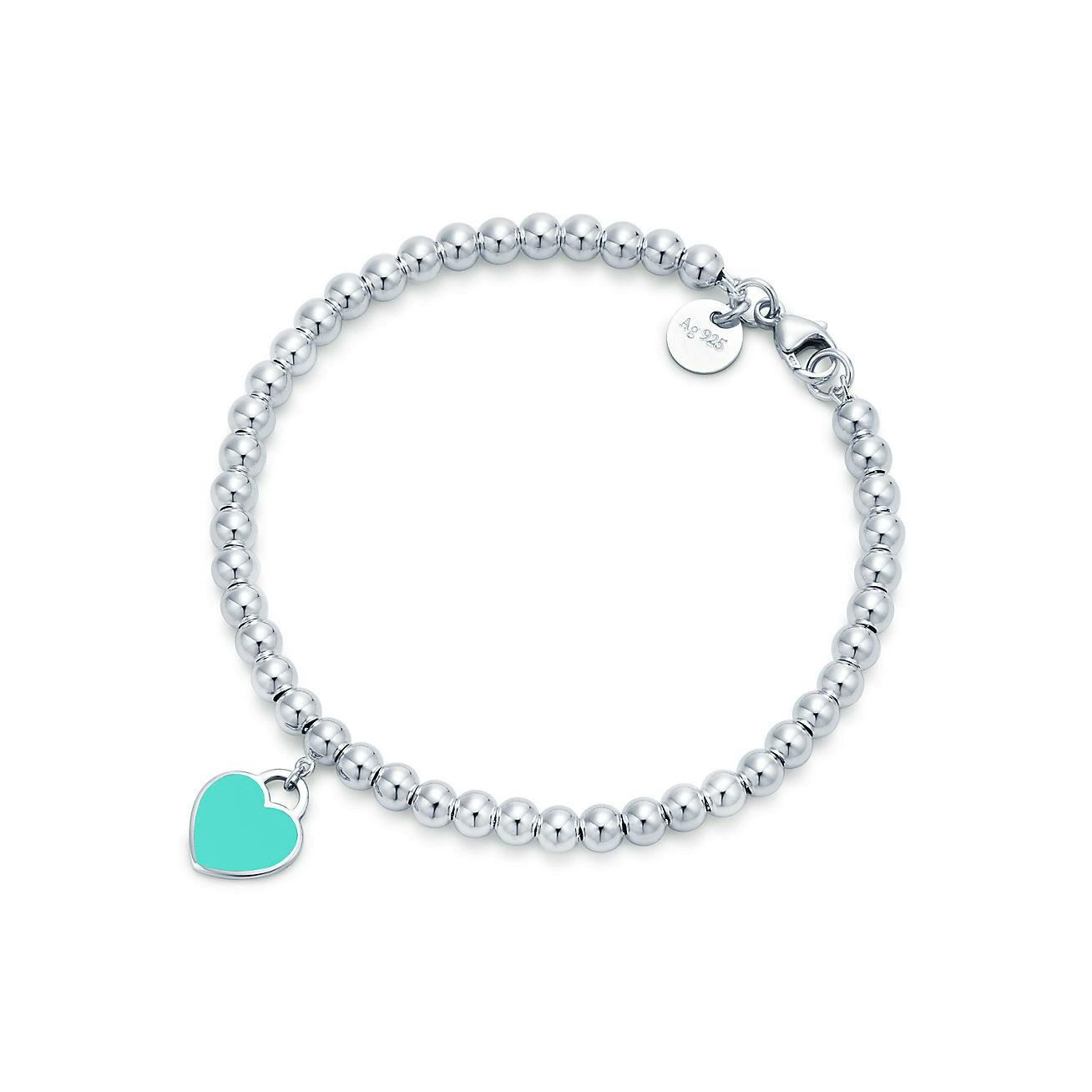 Silver beaded bracelet with 4mm beads and a Tiffany blue heart tag charm on a white background.