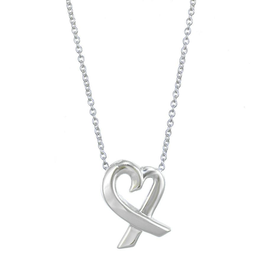 Close-up of the TIFFANY & Co. Loving Heart 925 sterling silver pendant on its chain against a white background.