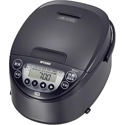 Front three-quarter photo of the TIGER rice cooker showing the lid and control panel.
