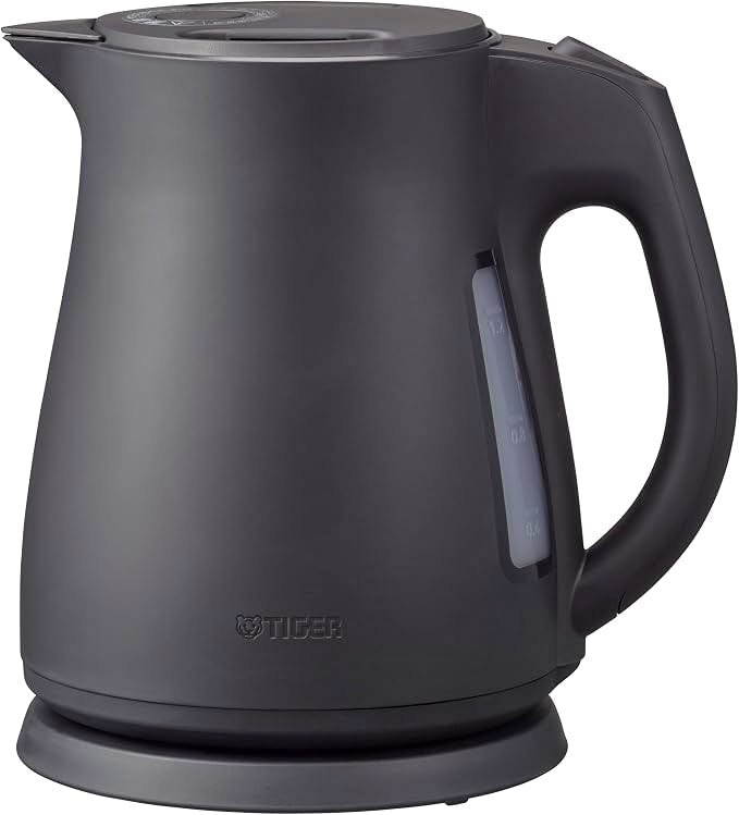 Matte black Tiger electric kettle showing the body, handle, water level window, lid, and round cordless base.