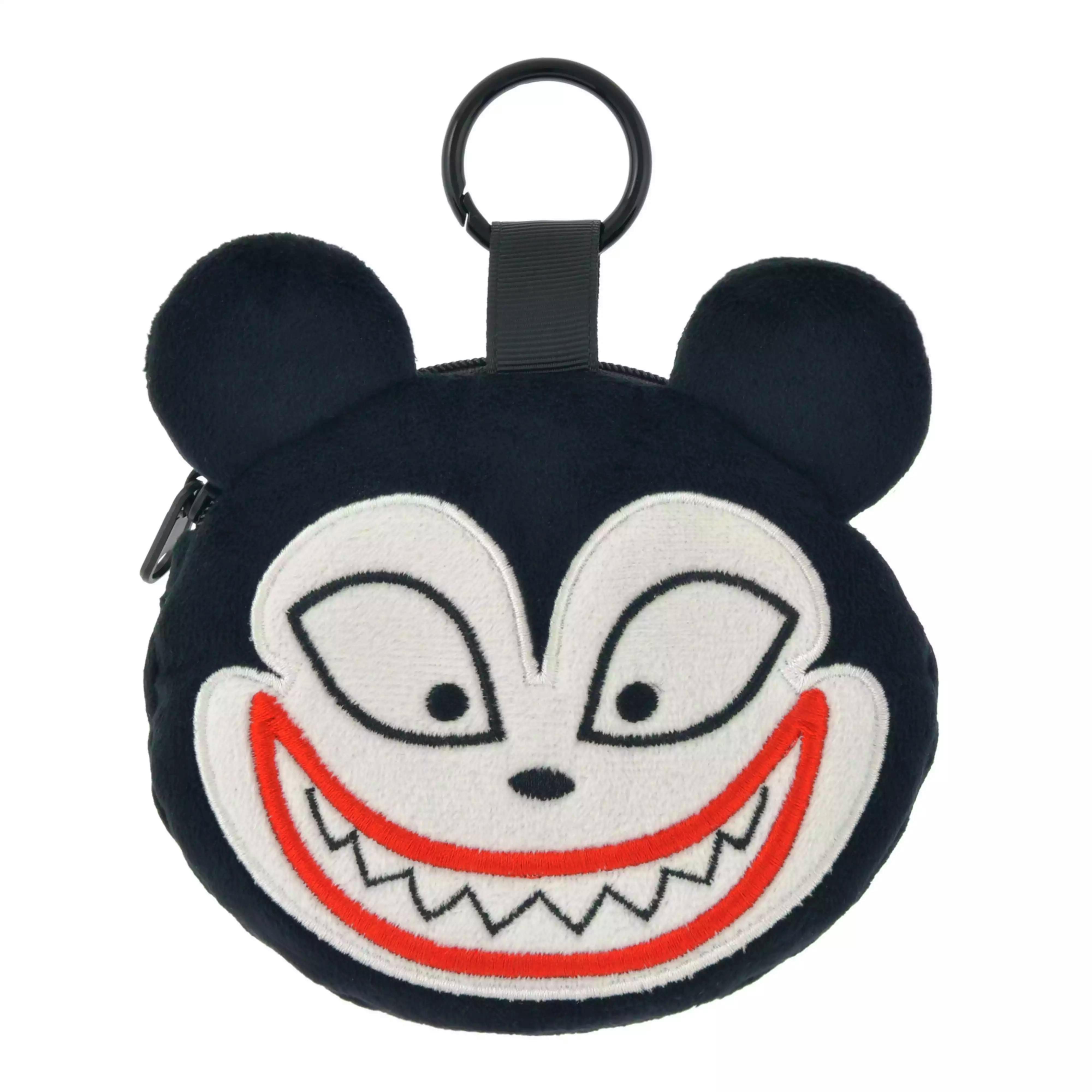 Close-up of the vampire teddy polyester pouch face showing embroidered eyes and mouth and the top loop with a black carabiner.