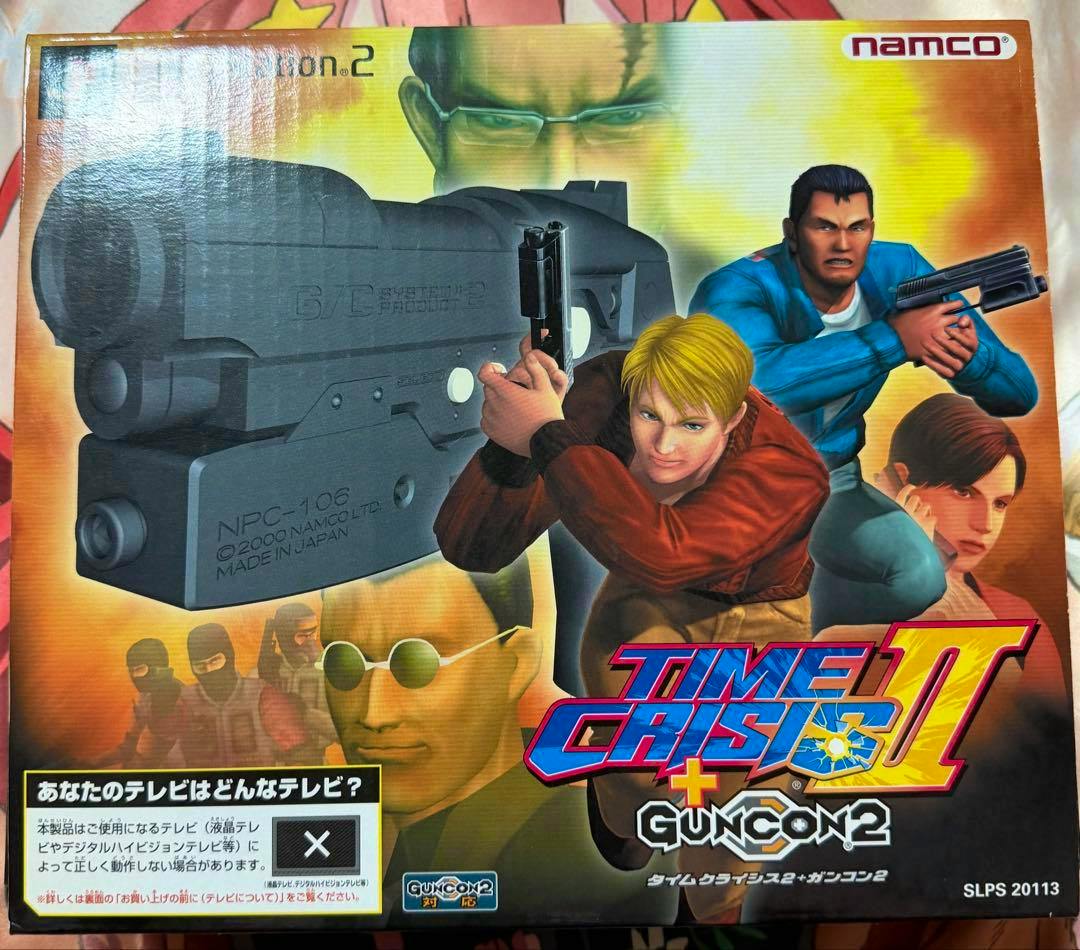 Front of the タイムクライシス2 ガンコン2同梱版 PS2 game box showing cover art with characters, a large gun image, and the Namco logo.