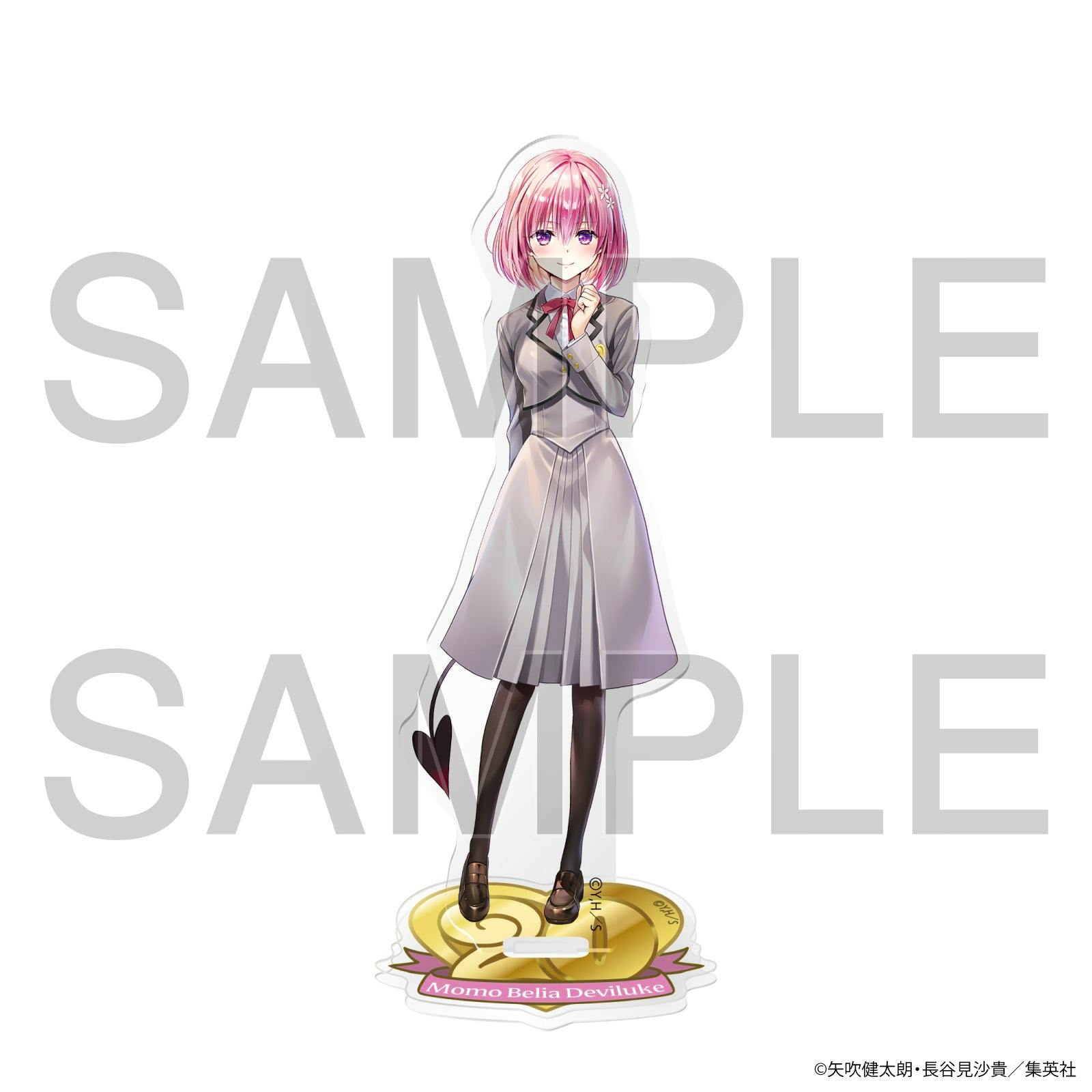 Front view of the acrylic stand showing Momo Belia Deviluke in a school uniform standing on a decorative base, with a SAMPLE watermark.