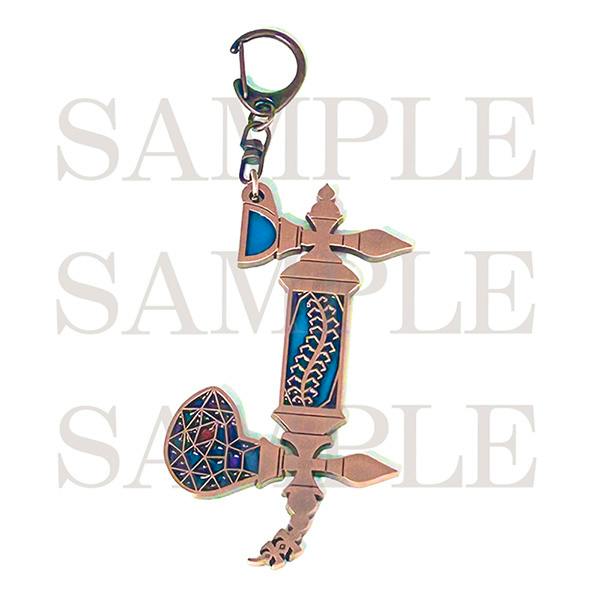 Photo of the zinc-alloy bag charm shaped like a telephone with blue stained-glass-style insets and a clasp.