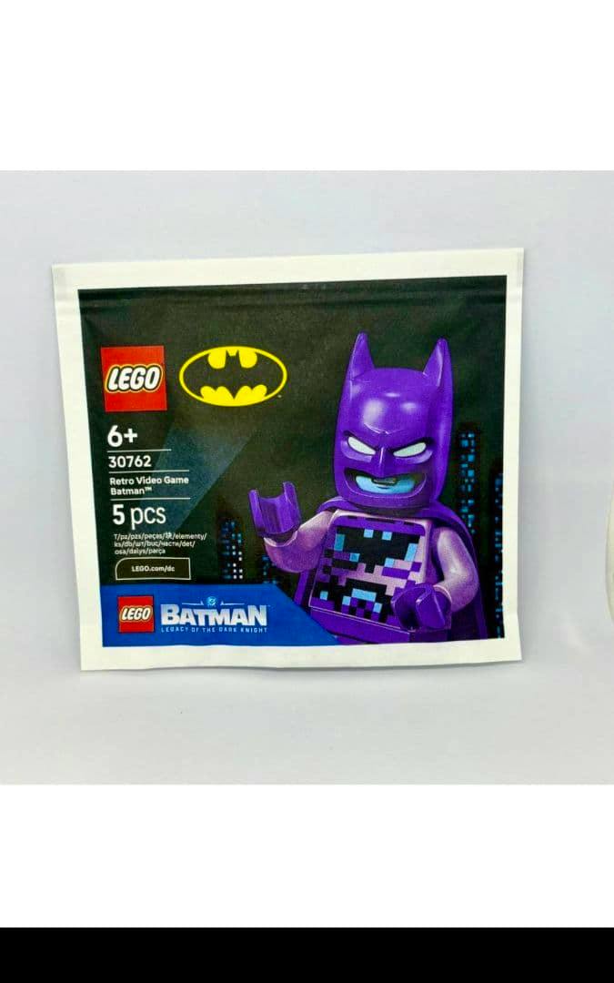 Front of a LEGO polybag artwork showing a purple retro video game Batman minifigure and LEGO logos.