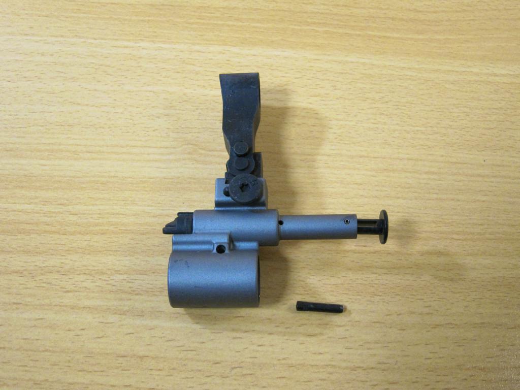 Front sight/front parts assembly for a Tokyo Marui Next‑Gen SCAR‑H airsoft rifle placed on a light wood tabletop.