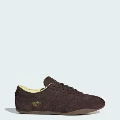 Side profile of a dark brown TOKYO W for EMMI leather sneaker on a plain background.
