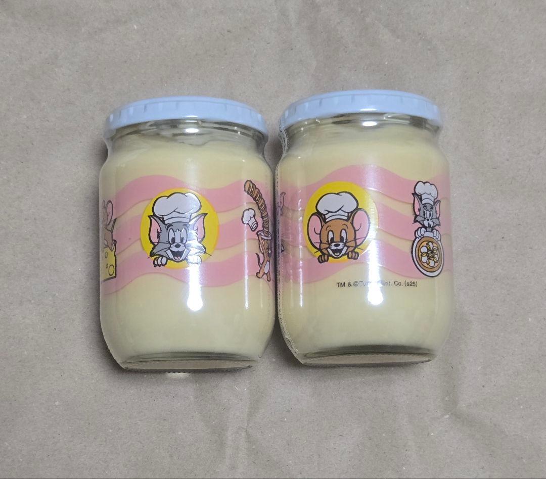 Two glass jars of mayonnaise with Tom and Jerry character illustrations on the labels.