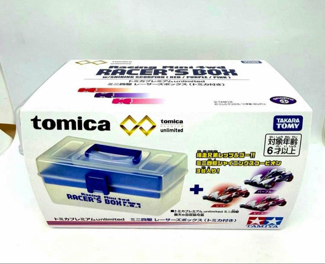Boxed Tomica Racing Mini 4wd Racer's Box packaging showing the included plastic storage case and images of three Shining Scorpion cars.