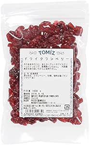 Clear resealable pouch of Tomizawa Shoten dried cranberries (3.5 oz / 100 g) with a white Japanese label visible on the front.