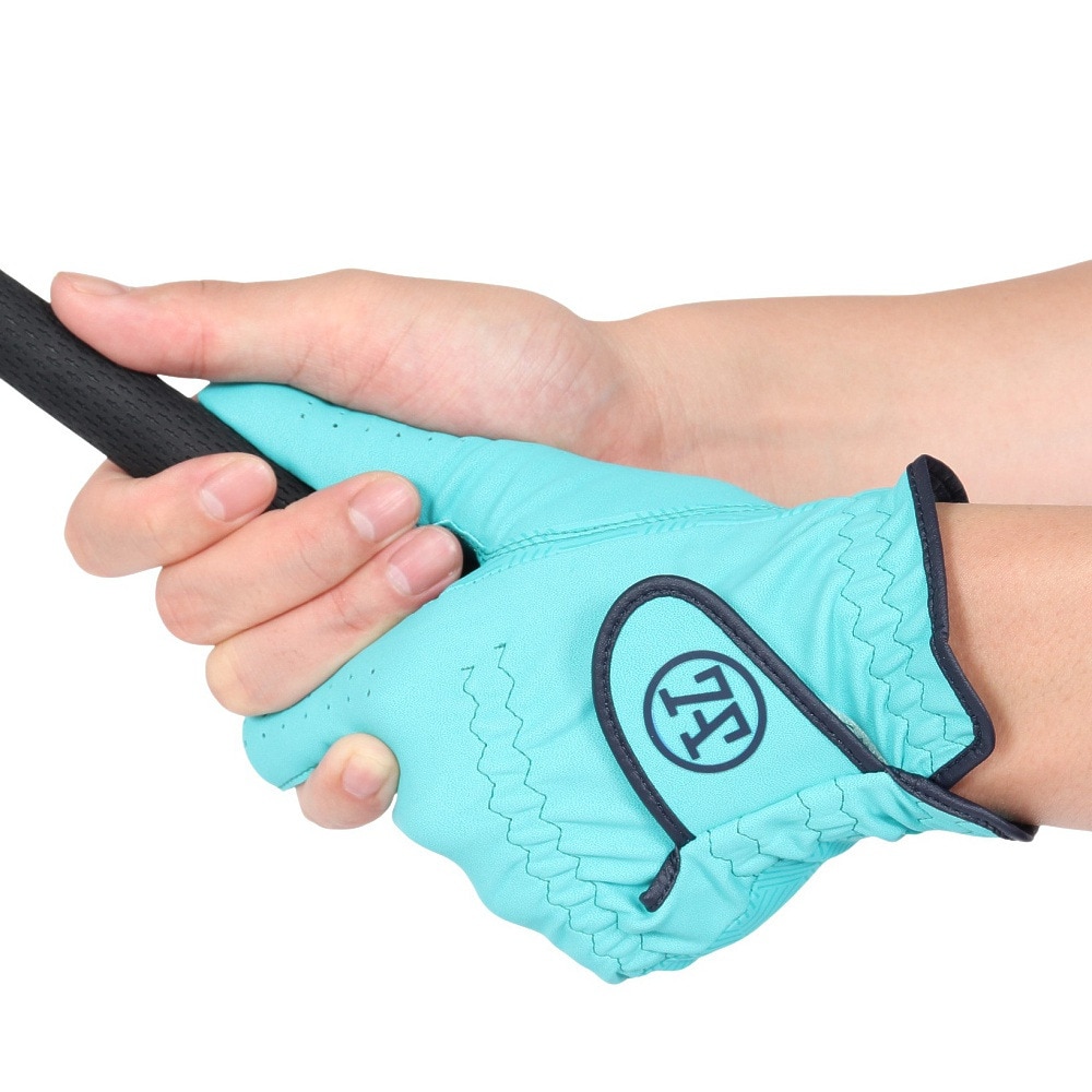 A left-hand SAX-color golf glove worn on a hand gripping a golf club.