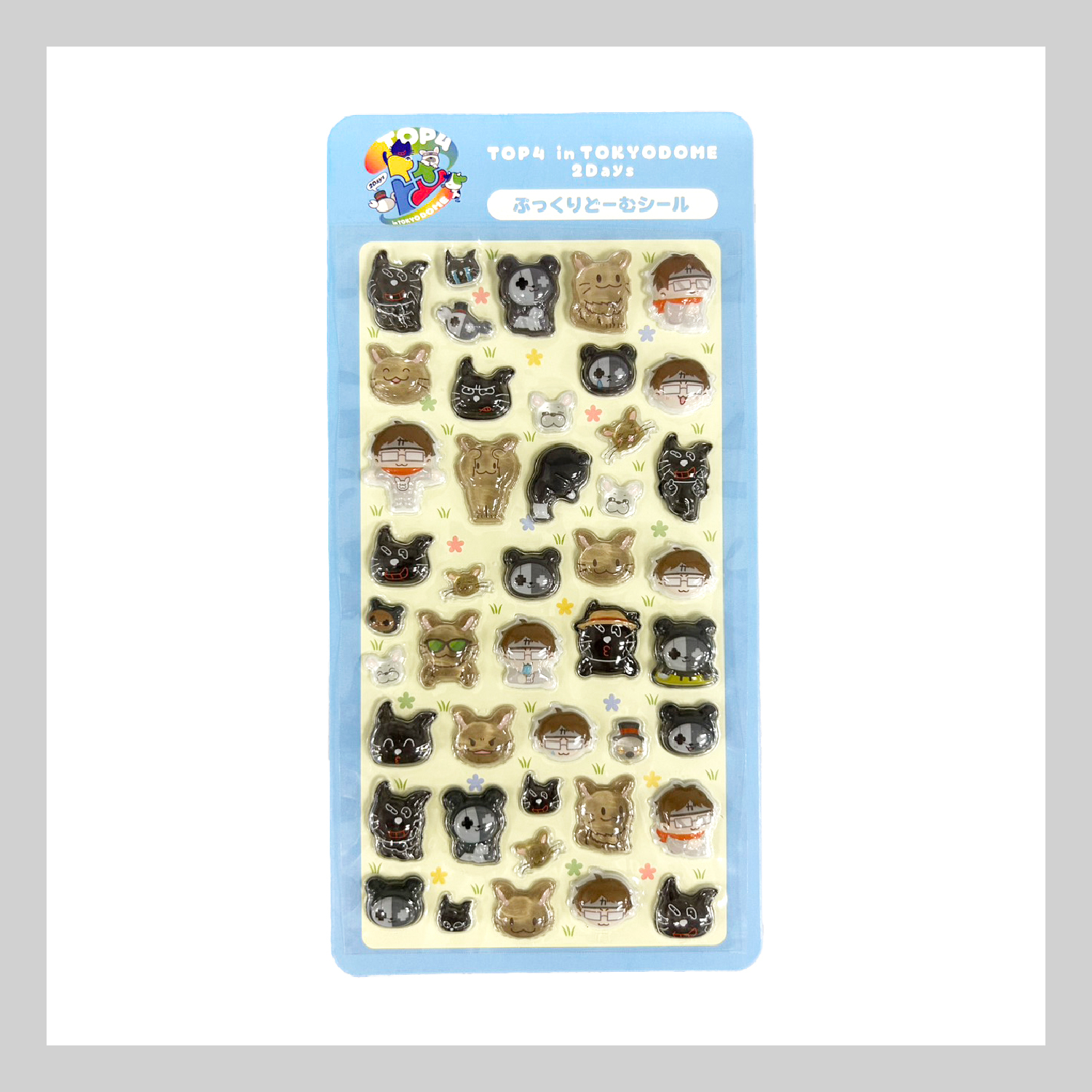 A sheet of TOP4 in TOKYO DOME 2Days puffy plastic stickers on blue backing showing multiple small character and animal face designs.