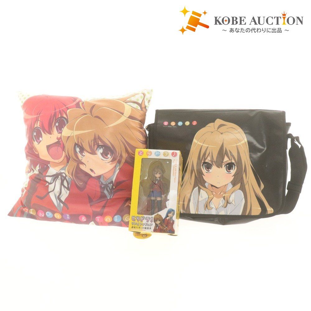 Toradora! printed cushion shown with a matching shoulder bag and a boxed figure on a white background.
