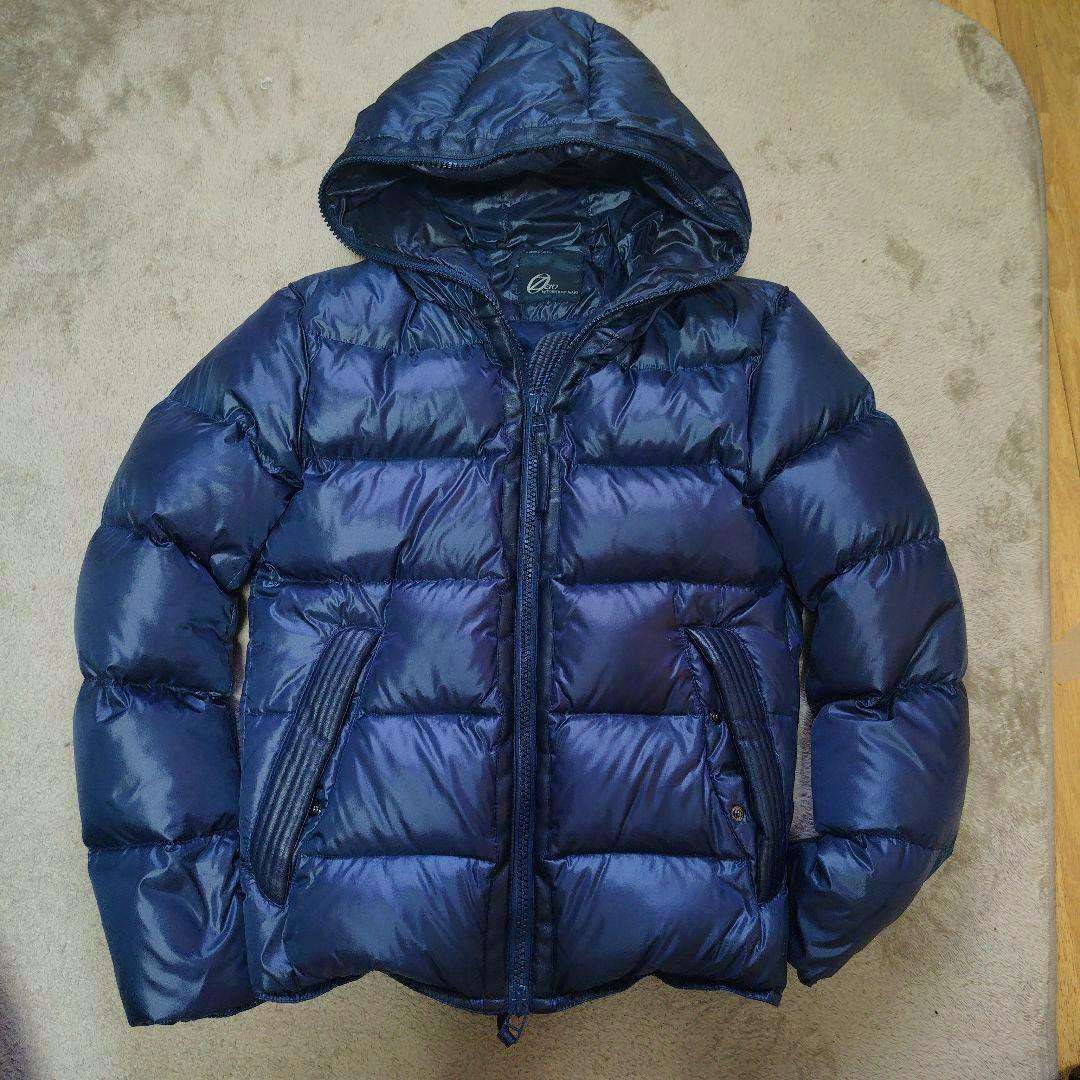Front view of a dark blue TORNADO MART men's nylon down jacket with hood, zipper, and front pockets laid flat.