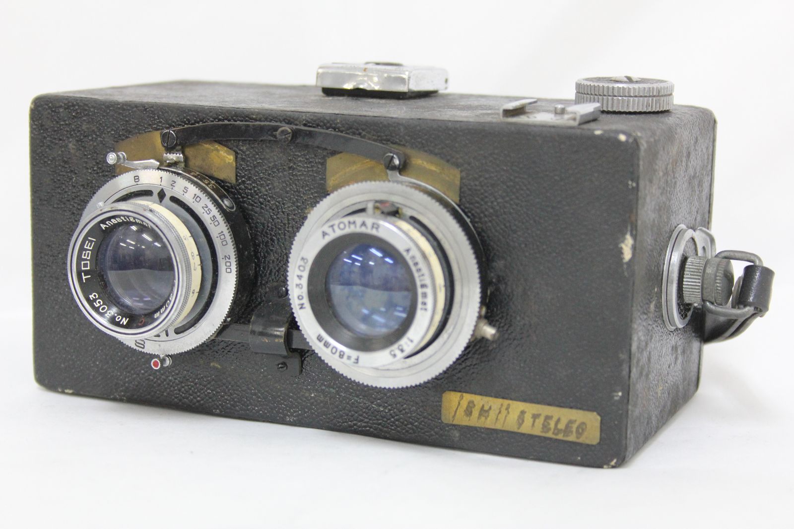 Front three-quarter view of the Tosei 80mm F3.5 twin‑lens 35mm film camera showing both lenses and body.