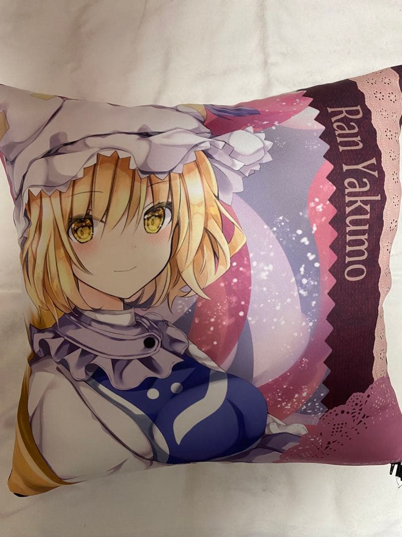 Front of a cushion showing an illustrated Ran Yakumo character from Touhou Project.