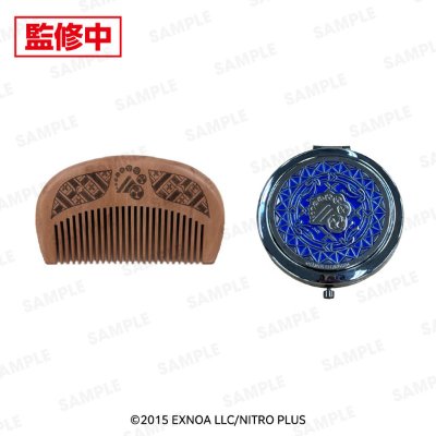 Photograph showing a wooden rounded comb and a round compact mirror with a blue decorative top on a white background.