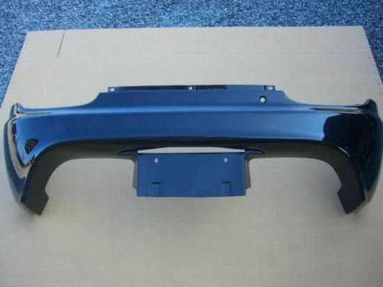 Toyoshima Craft FRP rear bumper for a Cappuccino shown laid flat on cardboard.