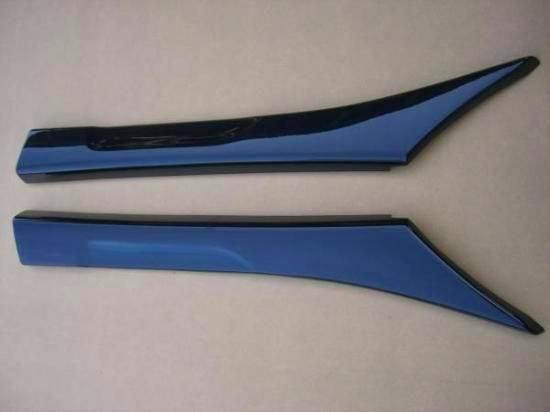 Two FRP upper door trim panels for a Cappuccino shown top-side on a plain background.