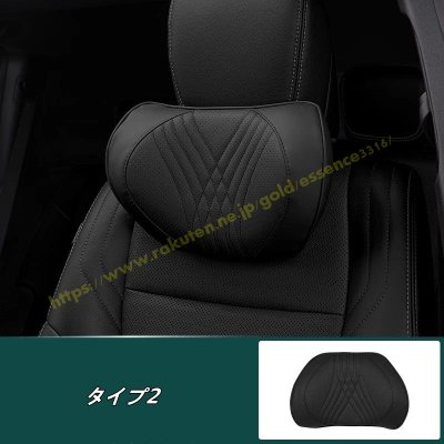 Black car neck support pillow attached to a front seat headrest.