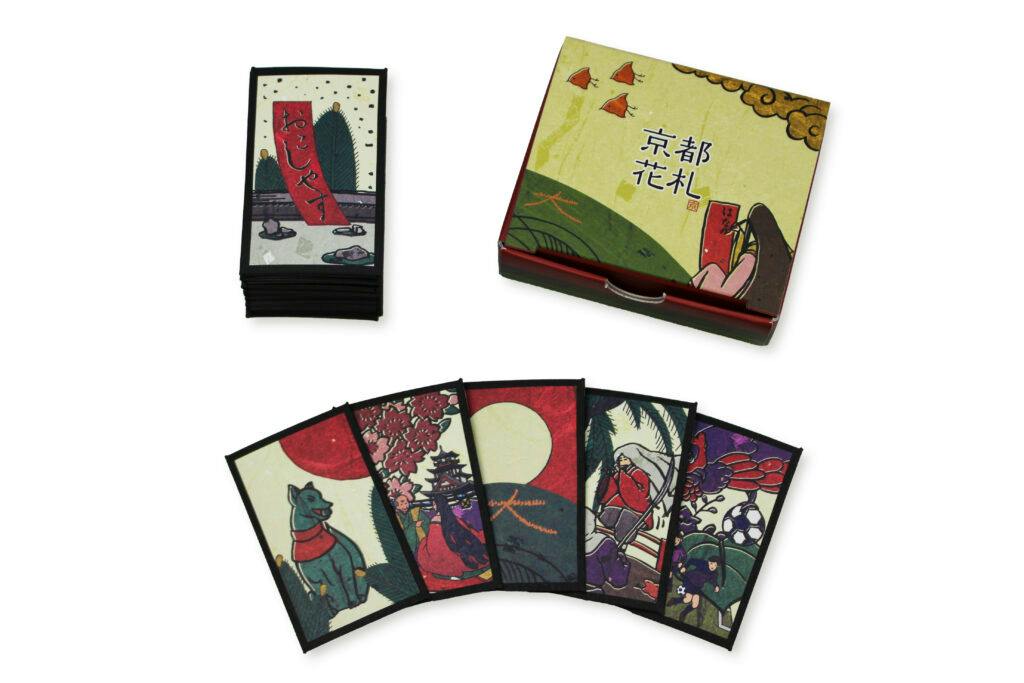 Hanafuda card game cards fanned out with a stack of cards and the decorative box.