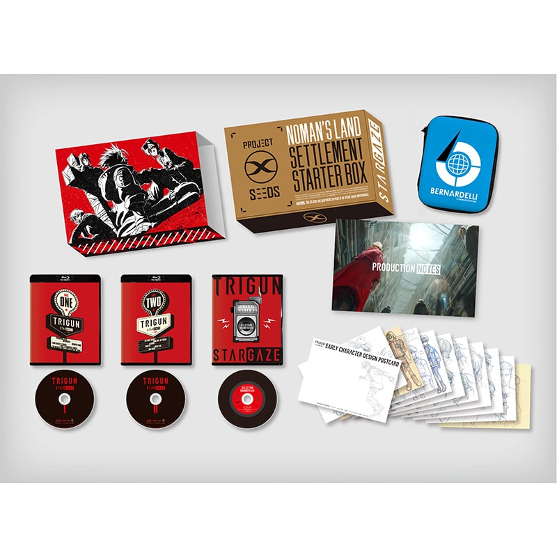 Photograph of the TRIGUN STARGAZE Blu-ray BOX contents laid out, showing the outer box, disc cases and discs, booklet, postcards, and a small pouch.