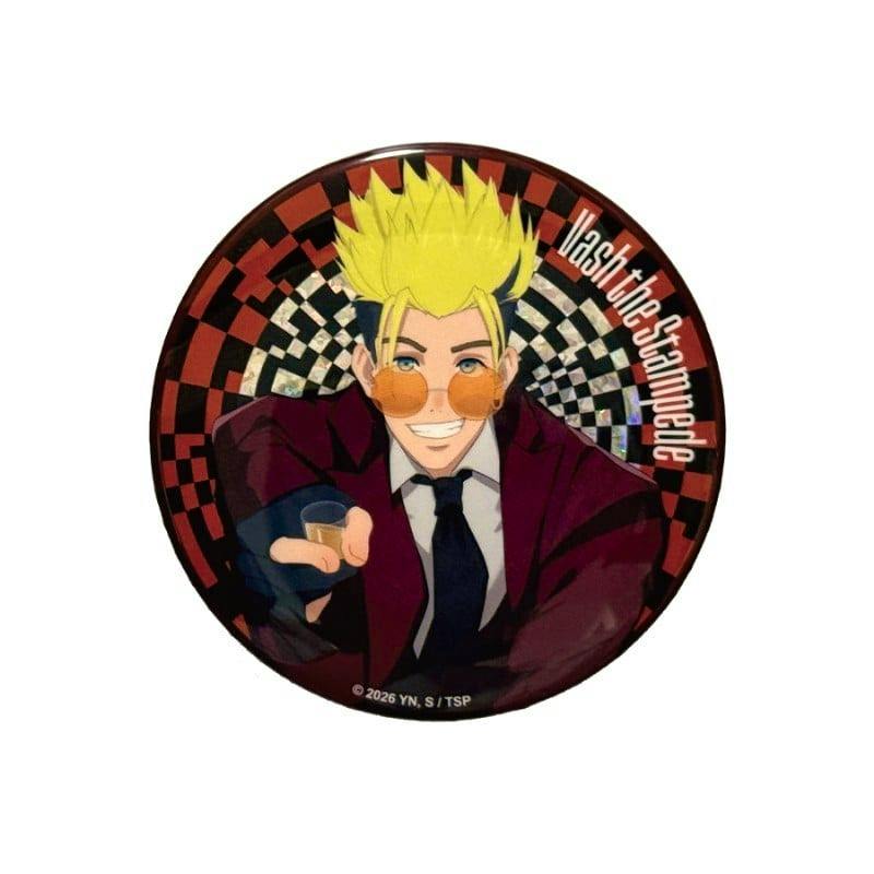 Round metallic can badge showing Vash the Stampede smiling and pointing, with a red-and-black checkered background and "Vash the Stampede" text.