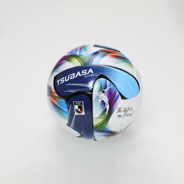 Mini soccer ball with TSUBASA branding and colorful abstract panels on a plain white background.
