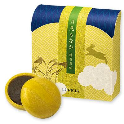 A boxed package of 月見もなか×抹茶栗餡 displayed with two monaka cookies, one opened to show the matcha chestnut filling.
