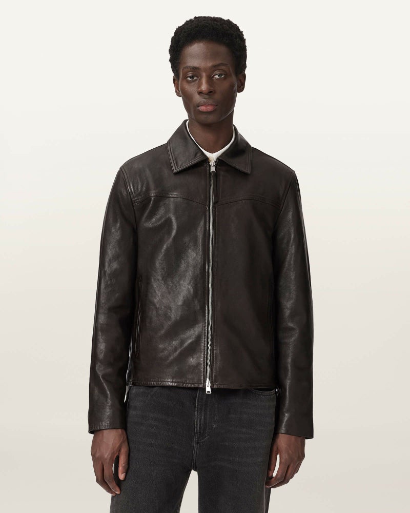 Front view of a model wearing the TUNE men's cow leather jacket with the front zipper closed.