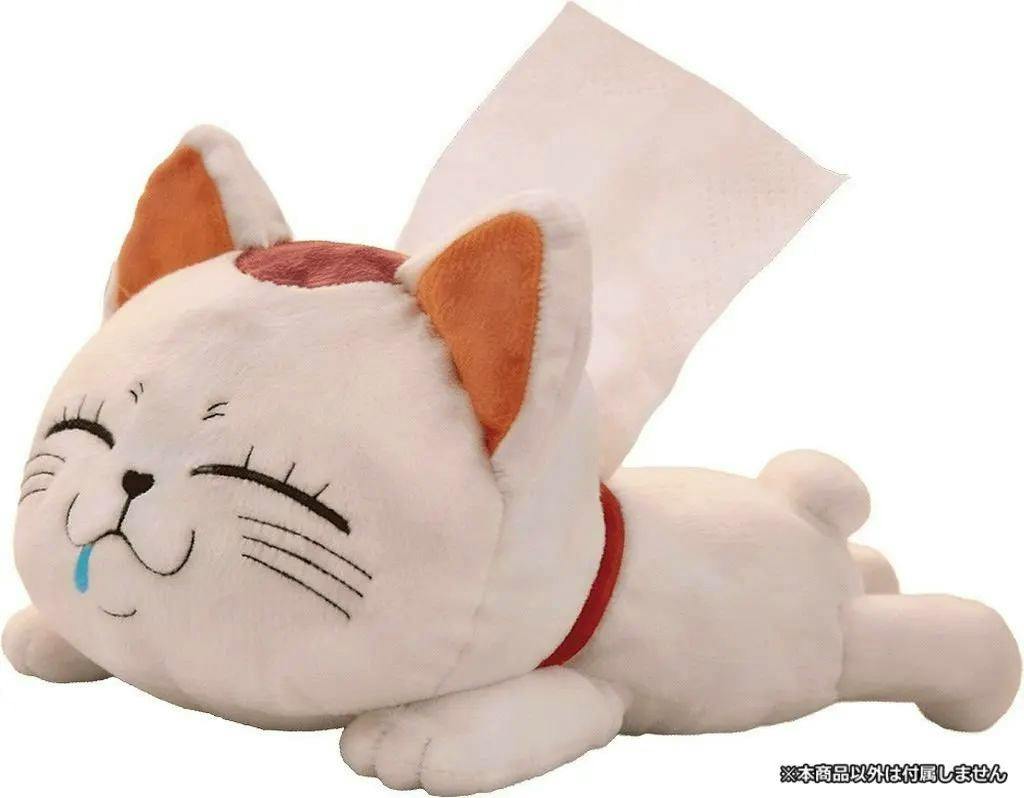 A white cat-shaped tissue case plush lying on its stomach with a tissue pulled from its back.