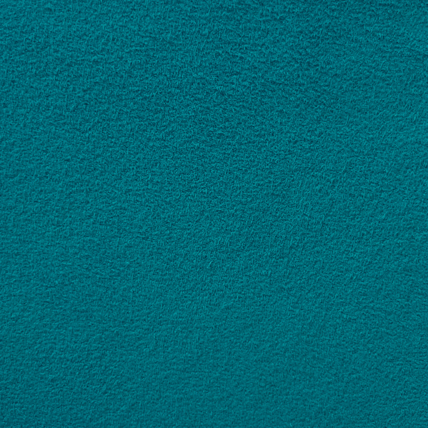 Close-up photo of turquoise synthetic micro-suede fabric showing the textured surface.