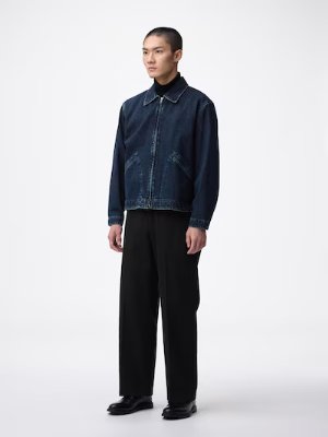 A model wearing black twill wide straight pants with a denim jacket against a white background.
