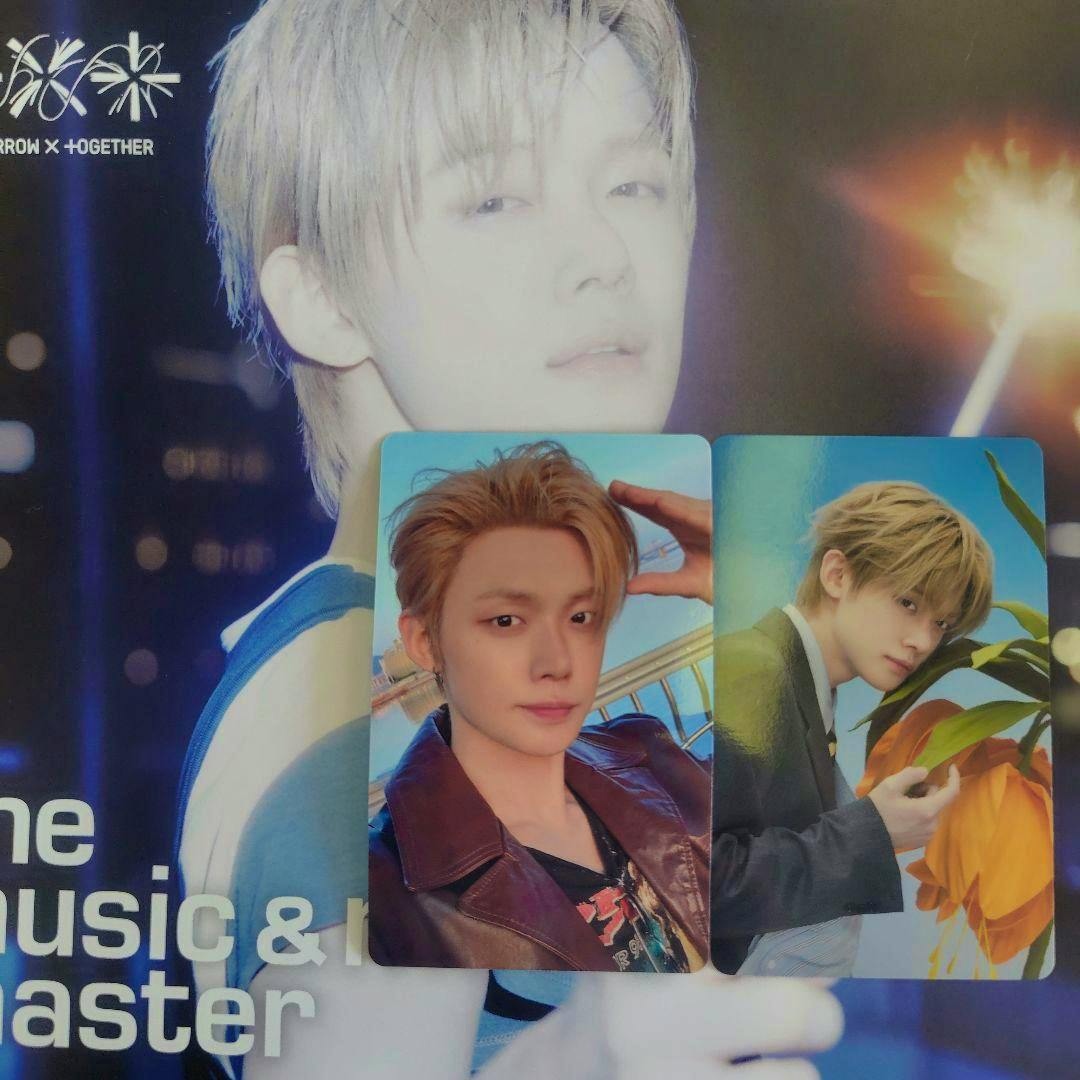 Two Yoonjun photocards placed on top of a larger printed flyer showing the same artist.