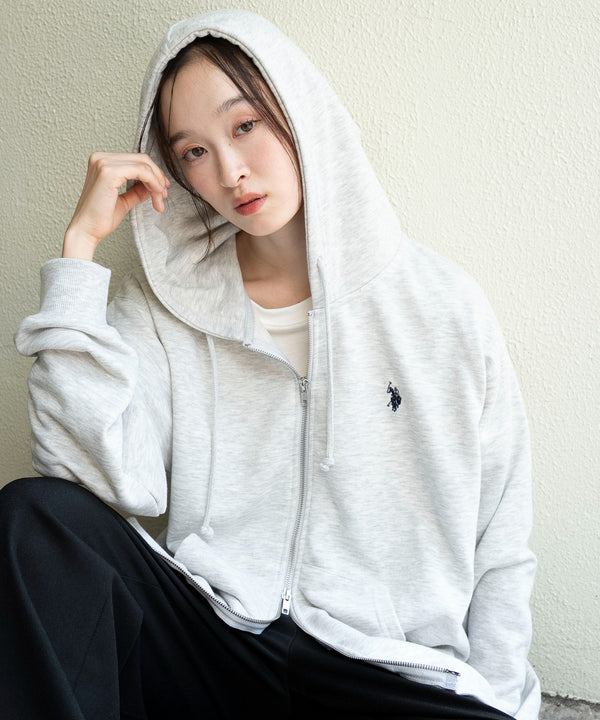 Model wearing a light gray zip-up women's hooded jacket with a small Polo logo on the chest.