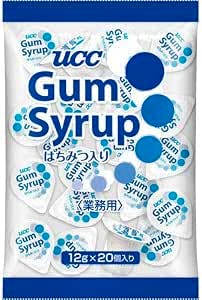 Front view of a pack of UCC Gum Syrup showing multiple small single-serve syrup cups and the product branding on the packaging.