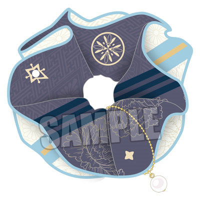 Top-down illustration of the hair band (scrunchie) in blue and dark patterned fabric with a small dangling charm and a SAMPLE watermark.